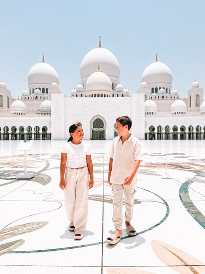 Two of the young Fishers outside Sheikh Zayed Grand Mosque. Photo: Clare Fisher