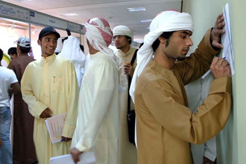 DUBAI - NOVEMBER 10,2009 - Emirati students looking for a job in Private and Public sector during Career fair held at Mens Dubai College in Dubai. ( Paulo Vecina/The National )