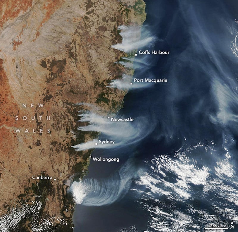 A handout photo made available by NASA Earth Observatory of a satellite image showing fires burning near the coast of New South Wales, near Canberra and areas north to the border with Queensland, Australia.  EPA