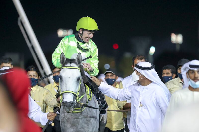 Jockey Patrick Cosgrave wins the Sheikh Zayed bin Sultan Al Nayhan National Day Cup for Purebred Arabians aboard Hameem.
