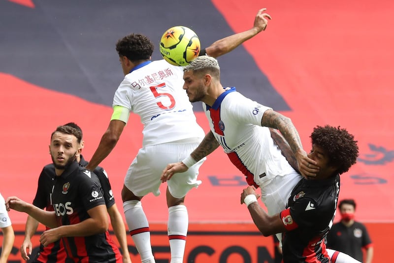 PSG's Mauro Icardi, centre,  heads the ball. AFP