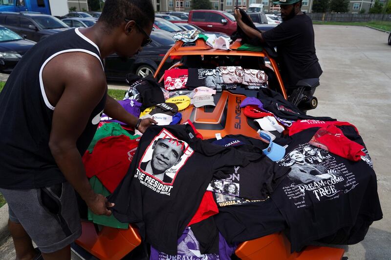 A street vendor sells T-shirts with former US President Barack Obama's faces printed in Houston, Texas. Reuters