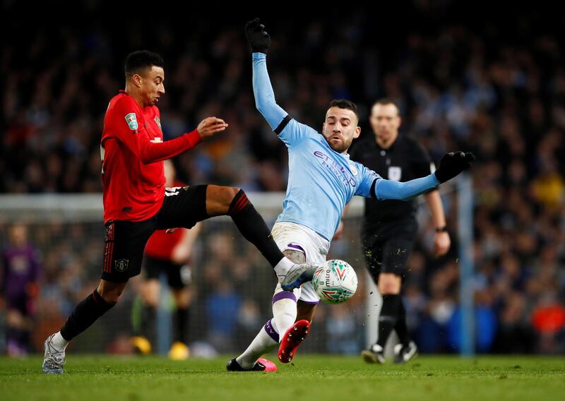 Manchester United's Jesse Lingard battles with Manchester City's Nicolas Otamendi. Reuters
