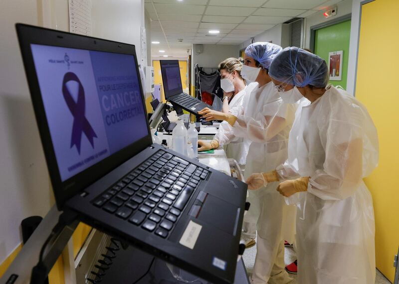 Medical staff members at work in the Covid-19 care unit in the private Polyclinique Saint Jean in Cagnes-Sur-Mer, south-eastern France. Reuters