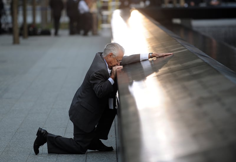 Robert Peraza, who lost his son Robert David Peraza, pauses at his son's name at the North Pool of the 9/11 Memorial during 10th anniversary ceremonies at the site of the World Trade Centre on September 11, 2011, in New York City. Getty Images