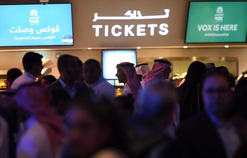 Saudis gather at a cinema theatre in Riyadh Park mall after its opening for the general public on April 30, 2018 in the Saudi capital. - Saudi Arabia lifted a decades-long ban on cinemas last year as part of a far-reaching modernisation drive, with AMC Entertainment granted the first licence to operate movie theatres. (Photo by Fayez Nureldine / AFP)