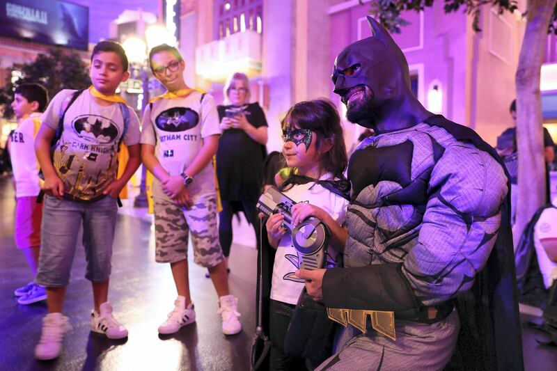 ABU DHABI ,  UNITED ARAB EMIRATES , SEPTEMBER 21 – 2019 :- Kids taking photos with Batman during the Guinness World Record for the Batman’s 80th anniversary held at Warner Bros  in Abu Dhabi. ( Pawan Singh / The National ) For News/Online/Instagram