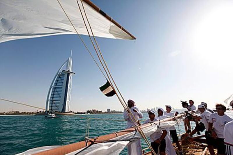Some of the world's leading yachtsmen play second fiddle to Emirati sailors in a spectacular dhow race between two of Dubai's most famous landmarks.