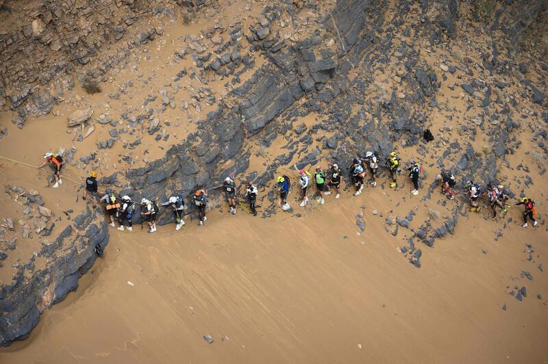 People compete in the stage 5 of the 34rd edition of the Marathon des Sables.  AFP