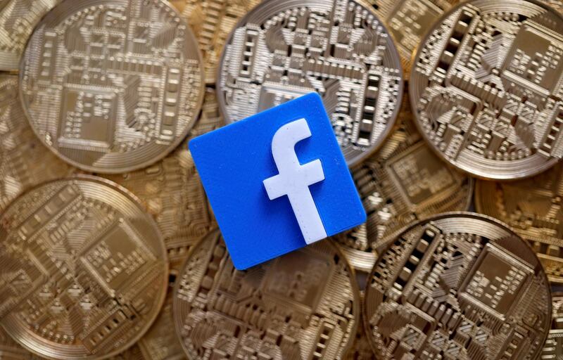 FILE PHOTO: A 3-D printed Facebook logo is seen on representations of the Bitcoin virtual currency in this illustration picture, June 18, 2019. REUTERS/Dado Ruvic/Illustration/File Photo