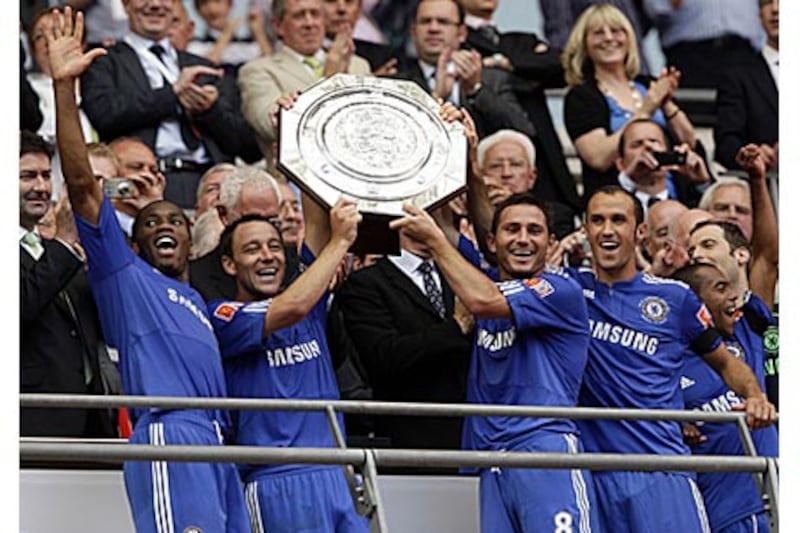 Chelsea's John Terry, left, and Frank Lampard lift the Community Shield after a 4-1 penalty shoot-out victory, following a 2-2 draw, over rivals Manchester United at Wembley.