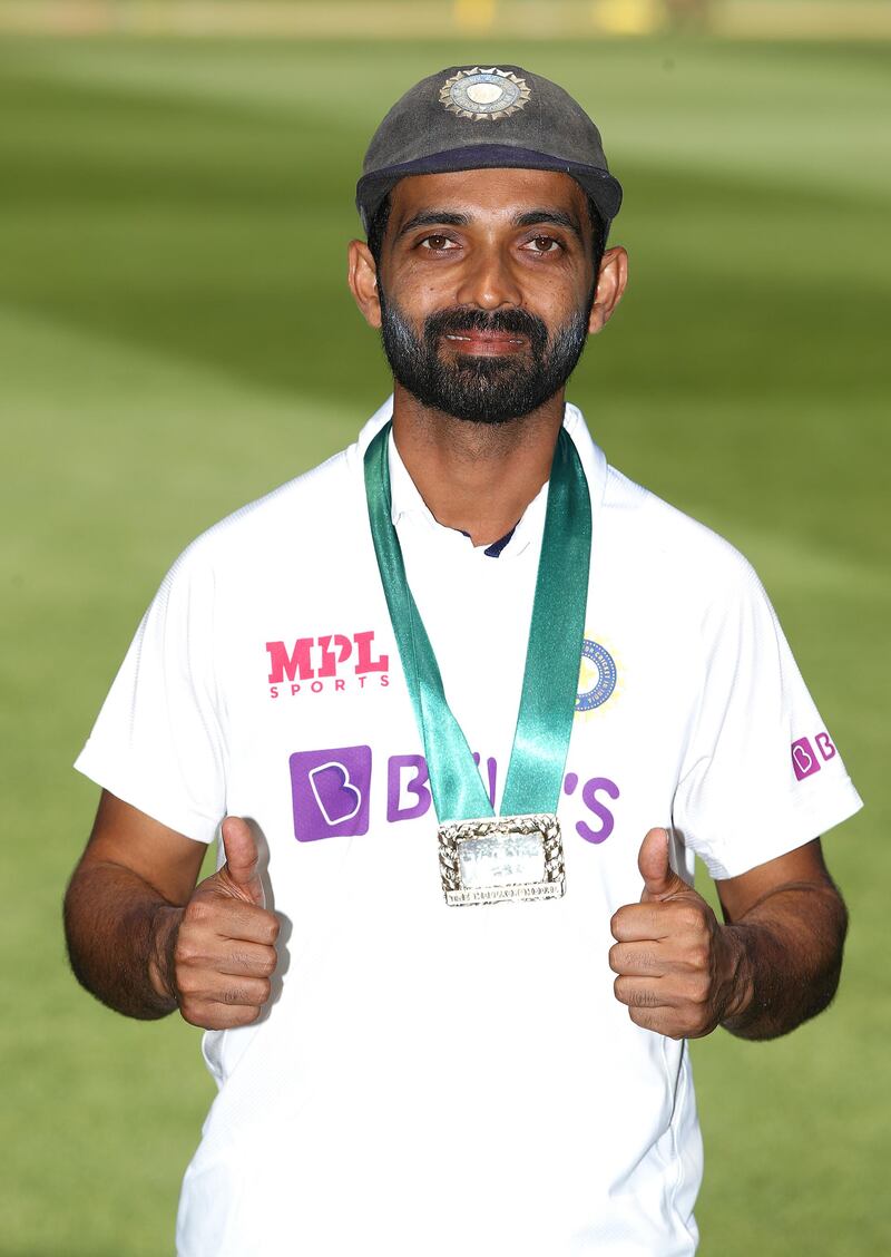 Ajinkya Rahane poses with the man of the match award after the Melbourne Test. Getty