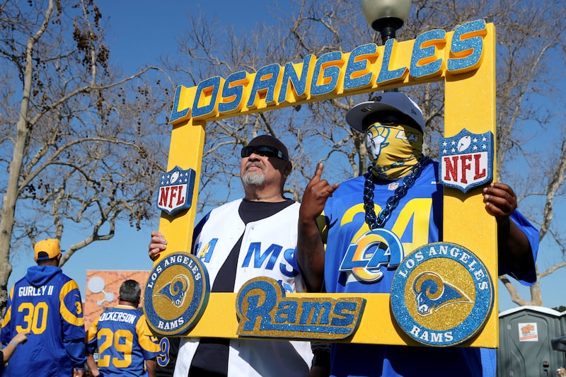 Los Angeles Rams fans take photos before the start of the NFL Super Bowl Championship parade on February 16, 2022. EPA