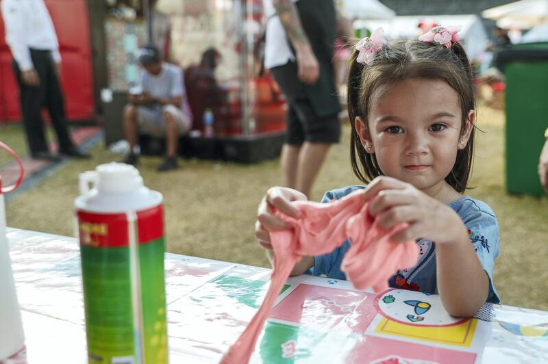 Abu Dhabi, United Arab Emirates, November 9, 2019.  
Taste of Abu Dhabi at the Du Arena.  
Tilly Croudson at the "slime" play areaat the fair.
Victor Besa/The National
Section:  NA
Reporter: