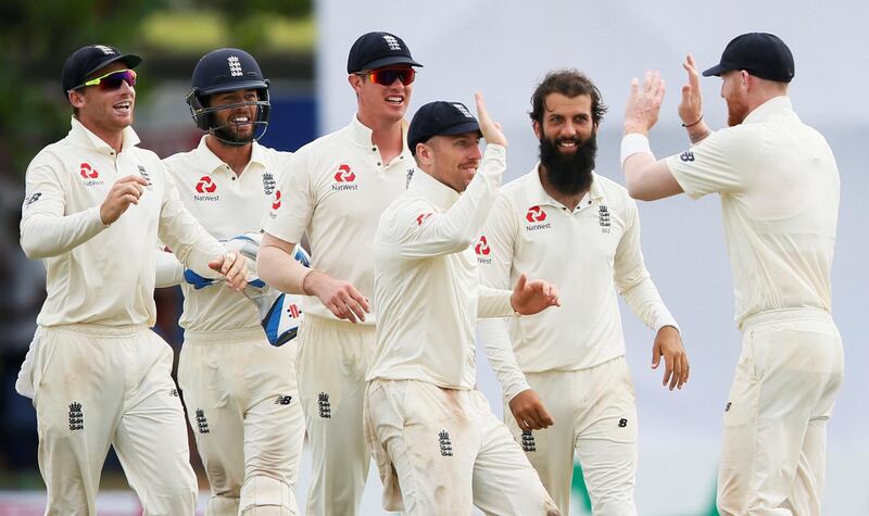 Cricket - England v Sri Lanka, First  Test - Galle, Sri Lanka - November 9, 2018. England's Moeen Ali (2nd R) celebrates with his teammates Ben Stokes (R), Jack Leach (C), Keaton Jennings (3rd L), Ben Foakes (2nd L) and Jos Buttler after taking the wicket of Sri Lanka's Niroshan Dickwella (not pictured). REUTERS/Dinuka Liyanawatte