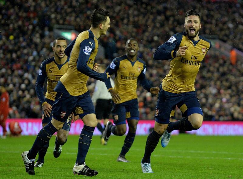 Arsenal’s Olivier Giroud (R) celebrates with teammates after scoring the fifth goal making the score 3-2 during the English Premier League soccer match between Liverpool and Arsenal at Anfield, Liverpool, Britain, 13 January 2016.  EPA/PETER POWELL