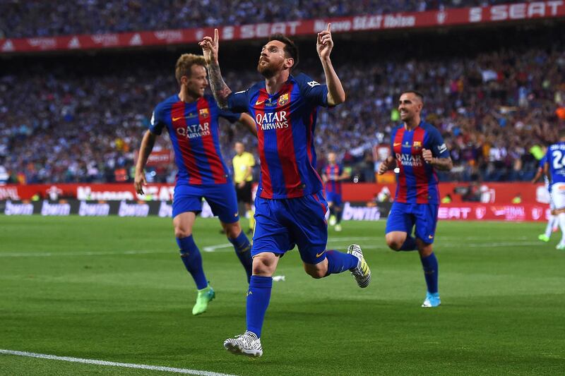 Barcelona's Argentinian forward Lionel Messi (C) celebrates after scoring the opener during the Spanish Copa del Rey (King's Cup) final football match FC Barcelona vs Deportivo Alaves at the Vicente Calderon stadium in Madrid on May 27, 2017. (Photo by Josep LAGO / AFP)