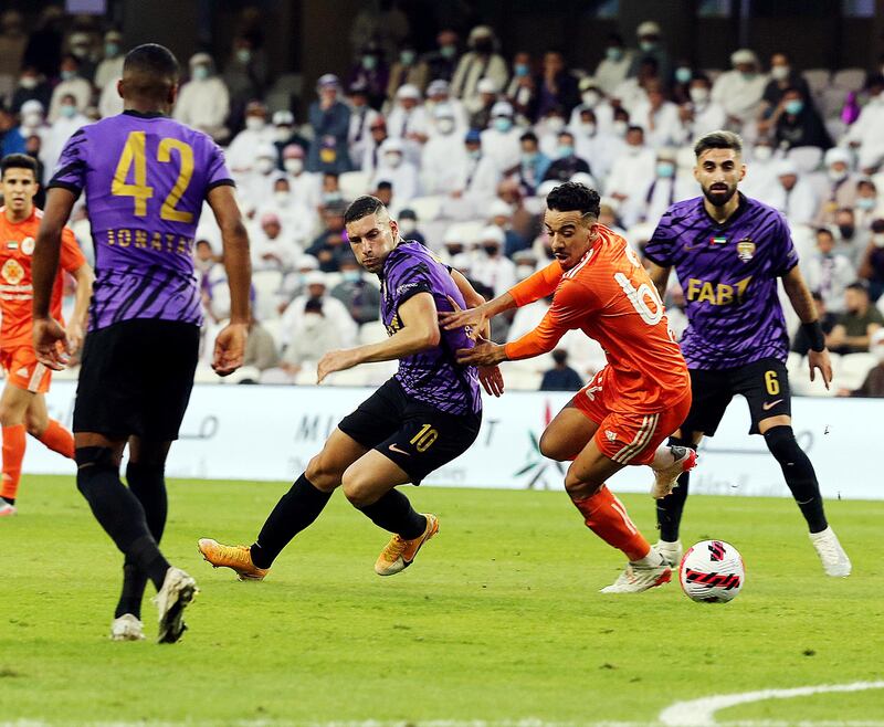Cristiano Guanca slips past an Ajman player in their 2-1 win at the Hazza bin Zayed Stadium on Thursday, December 30, 2021. Photo: PLC