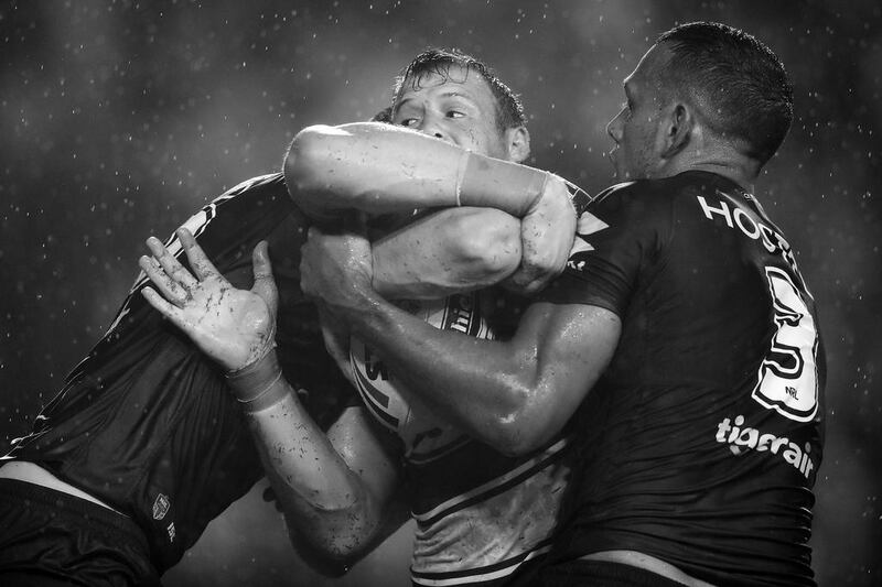 Josh Morris of the Bulldogs is tackled during a match between the Canterbury Bulldogs and the Melbourne Storm at Belmore sports ground on March 3, 2017 in Sydney, Australia. Mark Kolbe / Getty Images