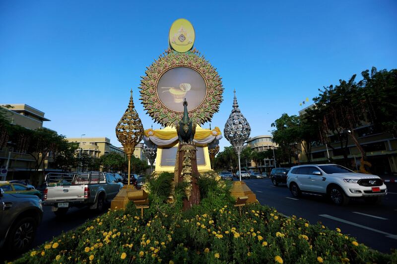 A billboard shows Thai King Maha Vajiralongkorn's regalia to be used during his three-day coronation ceremony in Bangkok. Reuters