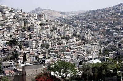 This Monday, Sept. 9, 2019 photo, shows a view of the east Jerusalem neighborhood of Silwan. New official data obtained by The Associated Press shows a spike in Jewish settlement construction in Israeli-annexed east Jerusalem since President Donald Trump took office in 2017, along with strong evidence of decades of systematic discrimination illustrated by a huge gap in the number of construction permits granted to Jewish and Palestinian residents. (AP Photo/Mahmoud Illean)