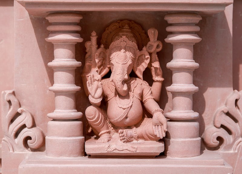 Ganesha, the elephant-headed god of wisdom and prosperity is depicted in one of the hand-carved friezes. Victor Besa / The National