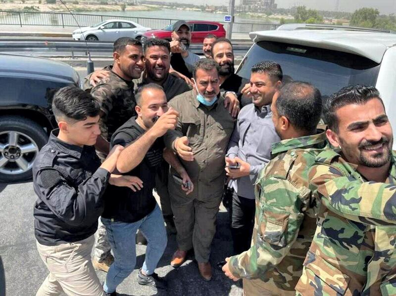 Iraqi militia commander Qassim Musleh with supporters following his release from government custody.