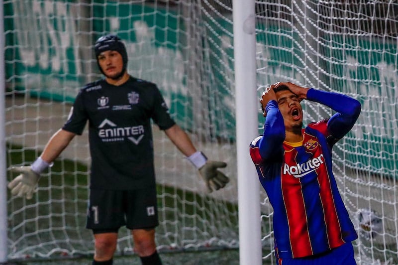 Barcelona's Ronald Araujo reacts after missing a chance at the Nou Municipal de Cornella. AP