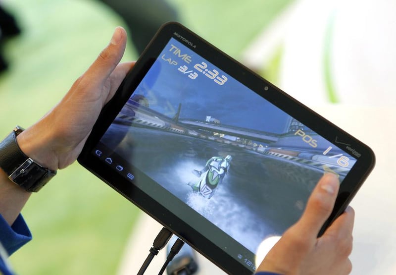 Android tablets accounted for 62 per cent of sales in 2013, compared with 46 per cent in 2012. Above, person plays a jet skiing game on a Motorola Xoom tablet running on Android. Beck Diefenbach / Reuters