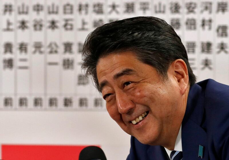 Japan's Prime Minister Shinzo Abe, leader of the Liberal Democratic Party (LDP), smiles during a news conference after Japan's lower house election, at the LDP headquarters in Tokyo, Japan October 22, 2017. REUTERS/Kim Kyung-Hoon