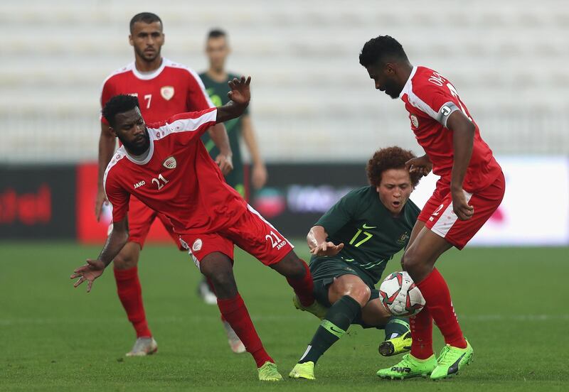 Mustafa Amini of Australia is tackled by Mataz Saleh of Oman during the international friendly match against Oman at Maktoum Bin Rashid Al Maktoum Stadium in Dubai on Sunday. Australia won the match 5-0 as part of their 2019 Asian Cup preparations. The tournament is being held in the UAE from January 5-February 1. Getty Images