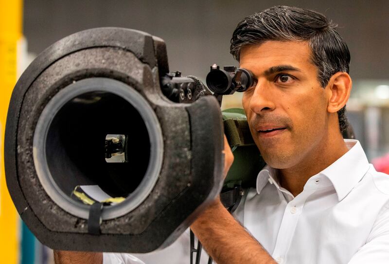 Rishi Sunak looks through the sights of an anti-tank missile launcher, supplied to Ukraine, during a visit to the Thales Defence System plant in Belfast, Northern Ireland. AP