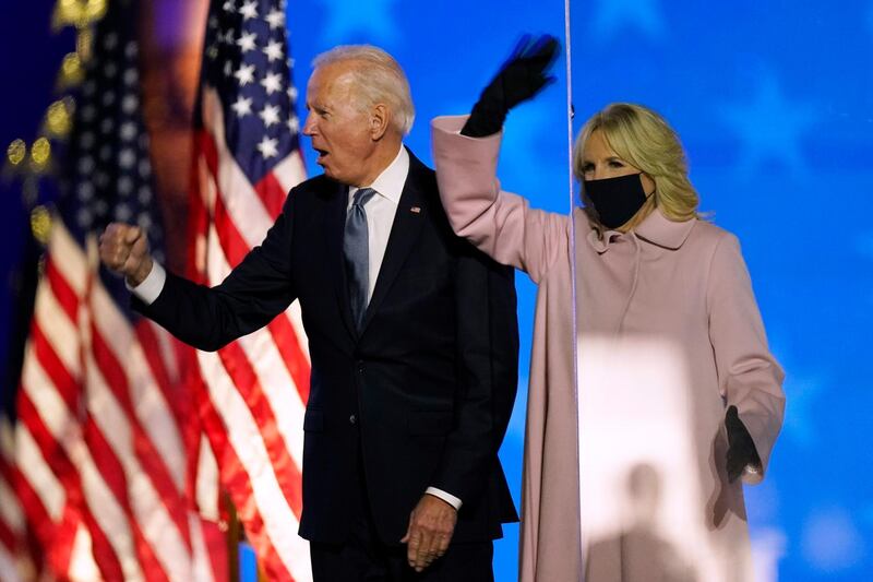 Democratic presidential candidate former Vice President Joe Biden and his wife Jill Biden wave to supporters, Tuesday, Nov. 3, 2020, in Wilmington, Del. AP Photo