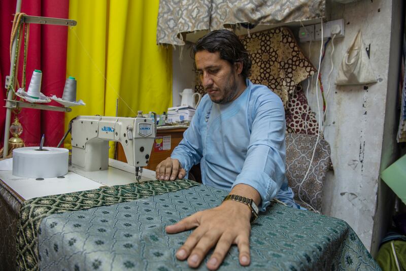Mohammed Aiyub from Pakistan has worked as a tailor for more than 15 years at the port.