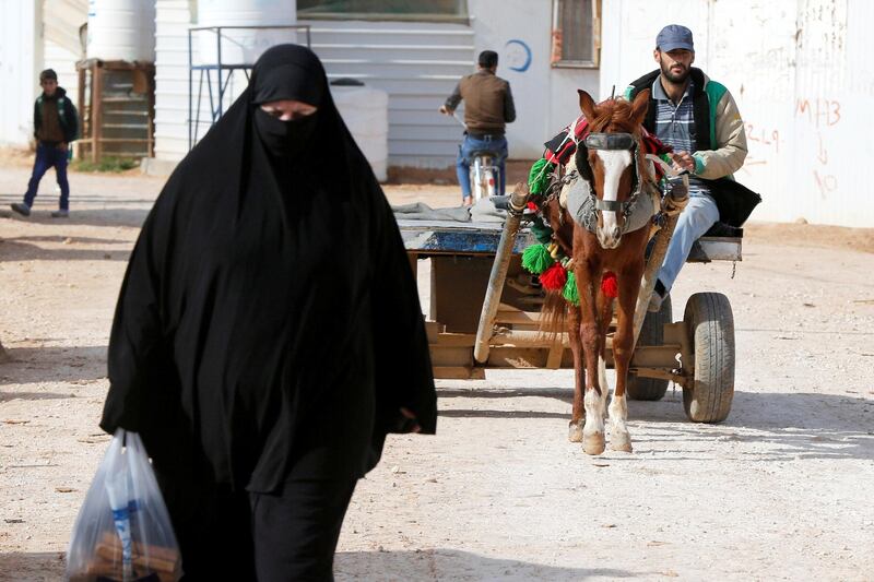 A Syrian refugee rides his donkey cart in Al-Zaatari. Reuters