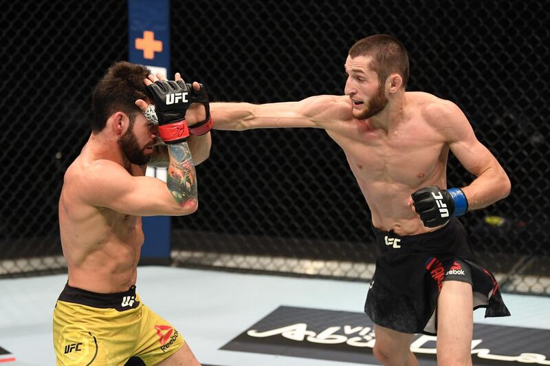 ABU DHABI, UNITED ARAB EMIRATES - OCTOBER 11: In this handout image provided by UFC,  (R-L) Tagir Ulanbekov of Russia punches Bruno Silva of Brazil in their flyweight bout during the UFC Fight Night event inside Flash Forum on UFC Fight Island on October 11, 2020 in Yas Island, Abu Dhabi, United Arab Emirates. (Photo by Josh Hedges/Zuffa LLC via Getty Images)