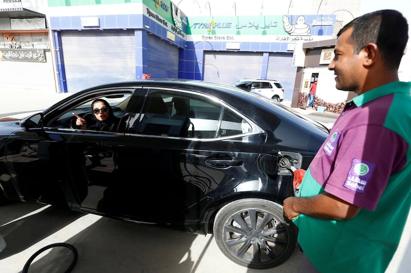 Majdooleen, who is among the first Saudi women allowed to drive in Saudi Arabia, refuels her car as she drives work in Riyadh, Saudi Arabia June 24, 2018. REUTERS/Faisal Al Nasser