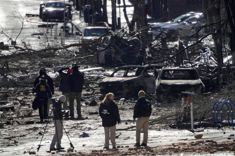 Investigators work near the site of an explosion on 2nd Avenue that occurred the day before in Nashville, Tennessee, U.S. REUTERS