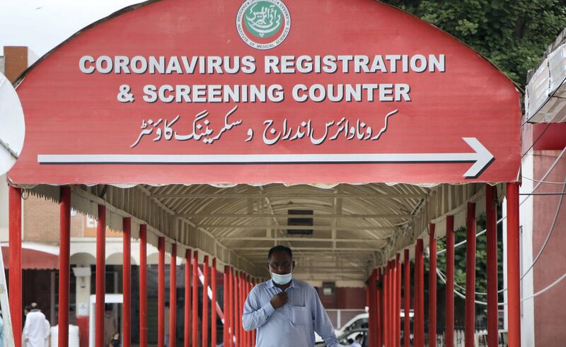 A sign board of coronavirus screening counter at the Pakistan Institute of Medical Sciences (PIMS), the largest public sector health facility in Islamabad. Imran Mukhtar/ The National 
