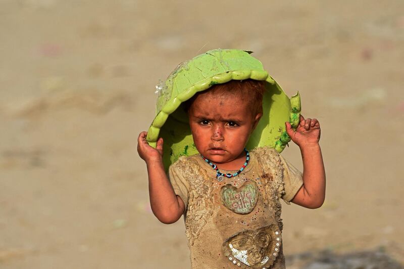 An Afghan child in Afghan Basti. The number of refugees, asylum seekers and internally displaced people has more than tripled in the past decade. AFP