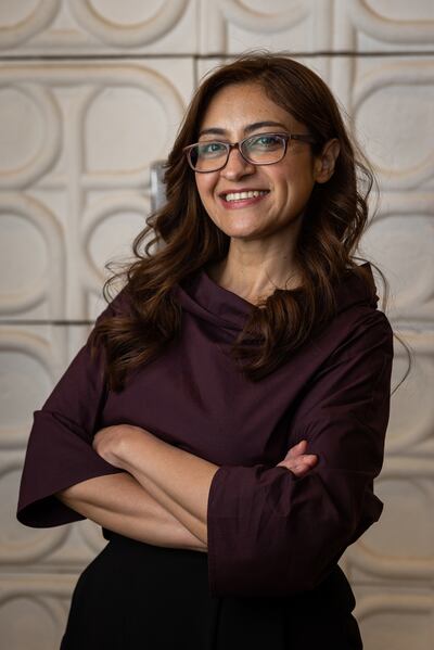 Dima Al Srouri, a UAE urban planner, stands in front of tiles made from mushroom mycelium at the Netherlands pavilion at Expo 2020 Dubai. Photo: Netherlands Pavilion Expo 2020 Dubai