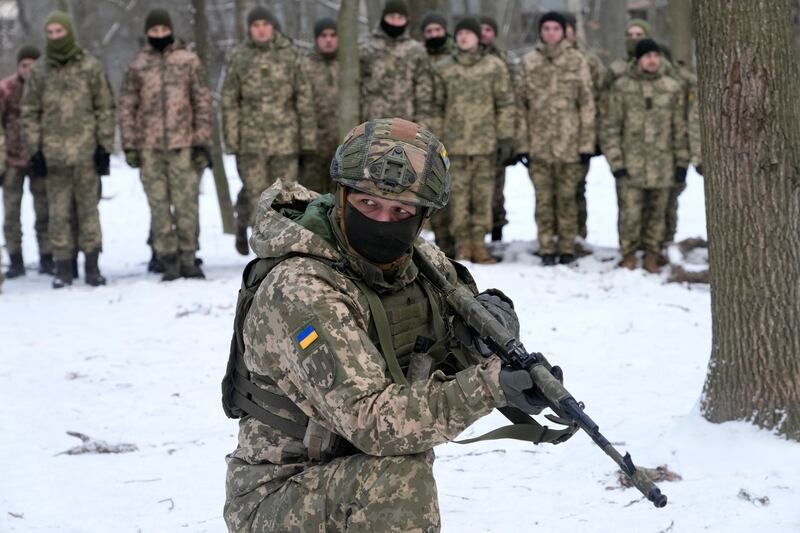 An instructor trains members of Ukraine's Territorial Defence Forces, volunteer military units of the armed forces, in the capital Kiev. AP