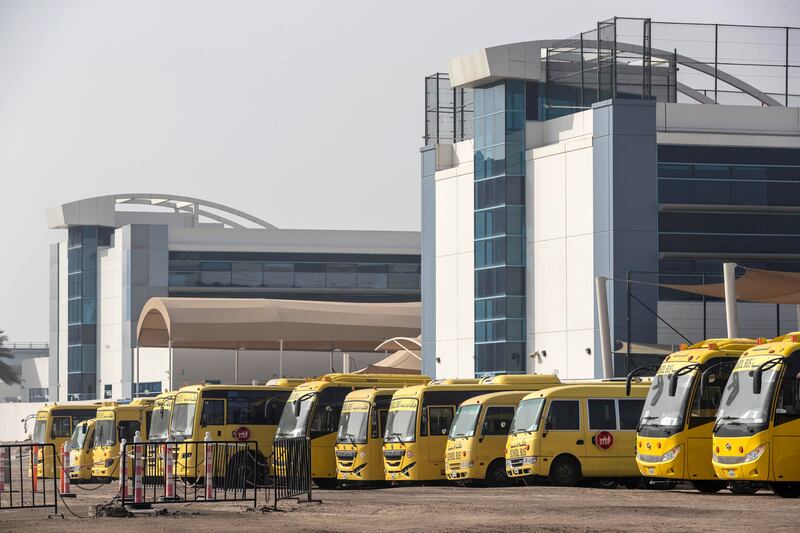 DUBAI, UNITED ARAB EMIRATES. 08 APRIL 2020. Unused school busses stand idle at the GEMS Wellington International School in al Sufouh. (Photo: Antonie Robertson/The National) Journalist: Standalone. Section: National.