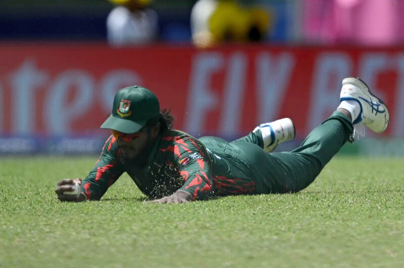 Bangladesh's Jaker Ali Anik catches out India's captain Rohit Sharma. AFP