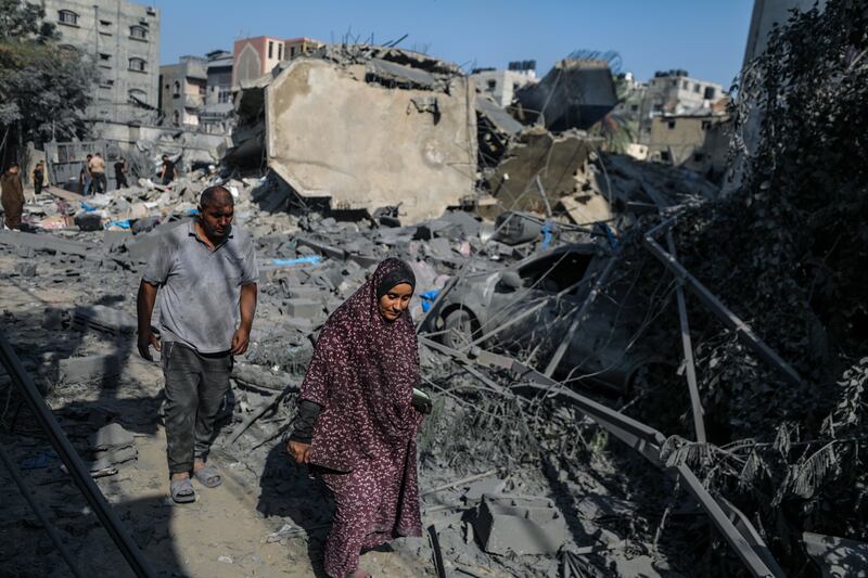 At least 13 members of the Shawa family were killed while eight others were still missing after an Israeli air strike destroyed their home. EPA