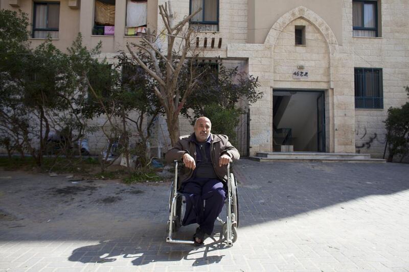 Nahed Abu Safi, 50, outside his apartment in Sheikh Zayed City. He was injured and lost his leg in 2004 during an  Israeli military attack. Unable to work, the family depends on their son Salah who takes his donkey and cart each morning to the market in Jabalya to sell vegetables. Heidi Levine for The National