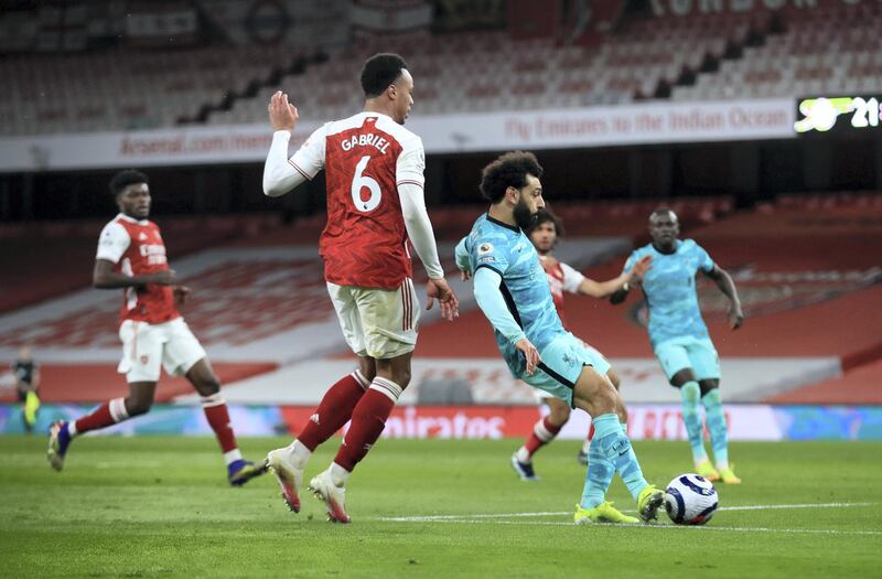 LONDON, ENGLAND - APRIL 03: Mohamed Salah of Liverpool scores their team's second goal during the Premier League match between Arsenal and Liverpool at Emirates Stadium on April 03, 2021 in London, England. Sporting stadiums around the UK remain under strict restrictions due to the Coronavirus Pandemic as Government social distancing laws prohibit fans inside venues resulting in games being played behind closed doors. (Photo by Adam Davy - Pool/Getty Images)