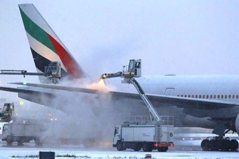 Emirates Airline says there are no seats available for some of the destinations it services over the the Christmas season. Above, an Emirates aircraft is de-iced after heavy snowfall at Dusseldorf airport in Germany. Ina Fassbender / Reuters