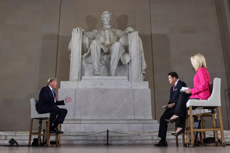 US President Donald Trump speaks during a virtual town hall at Lincoln Memorial in Washington. EPA