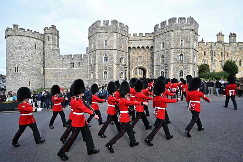 Scots Guards on the march in the grounds of Windsor Castle, as it reopened to visitors after a period of mourning for Queen Elizabeth II came to an end. AFP